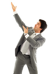 Image showing businessman showing imaginary product