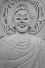 Image showing Stone image of Buddha on the wall