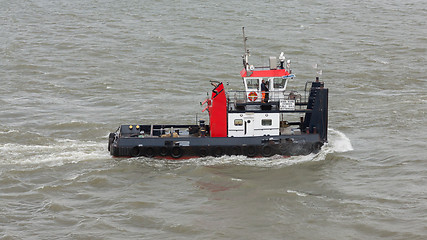 Image showing Pushing boat sailing in the port of Rotterdam (Holland)