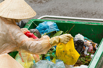 Image showing DA LAT, VIETNAM - 28 JULY 2012: Government worker separates the 