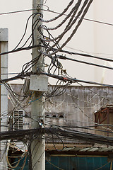 Image showing A tangle of cables and wires