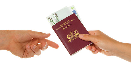 Image showing Woman giving passport with money