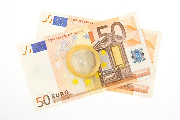 Image showing Condom on two 50 euro bills