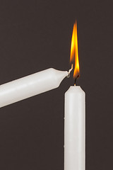 Image showing Burning white candle, isolated