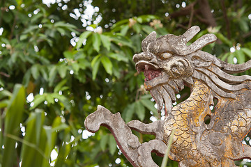 Image showing Chinese dragon ornament on a rooftop