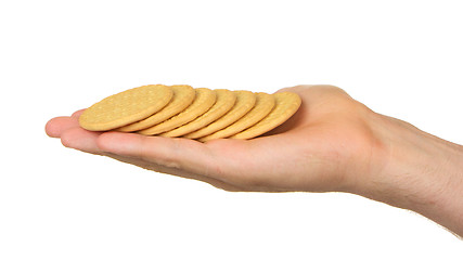 Image showing Man with a hand full of biscuits