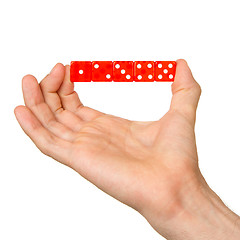 Image showing Man holding five red dice