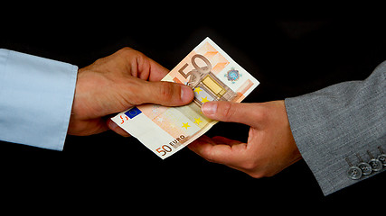 Image showing Man giving 50 euro to a woman (business)