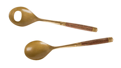 Image showing Old brass serving spoons isolated