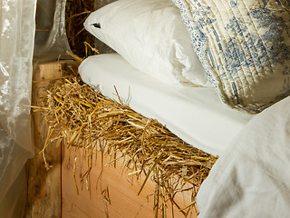 Image showing Bed on top of a haystac