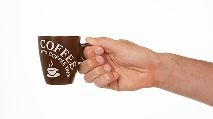 Image showing Man holding a cup of coffee