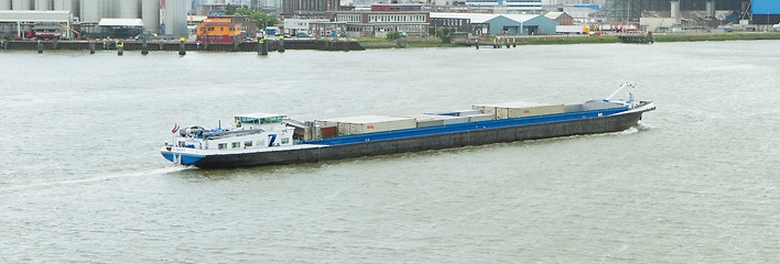 Image showing Motor cargo barge in the harbor of Rotterdam 