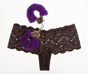 Image showing Fluffy purple handcuffs and panties, prostitution