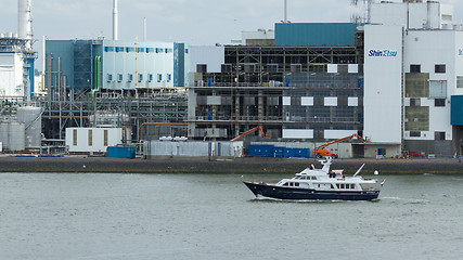 Image showing Small yacht sailing through the harbor of Rotterdam (Holland)