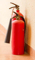 Image showing Two red fire extinguishers