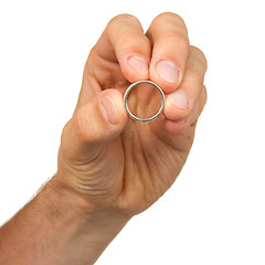 Image showing Man holding a silver ring