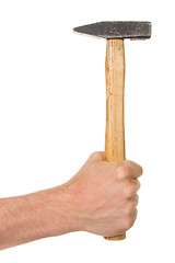 Image showing Man holding a old wooden hammer