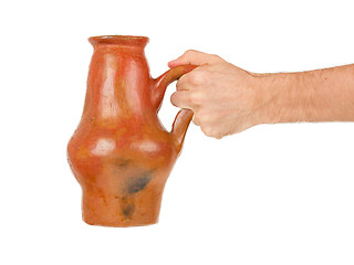 Image showing Man holding old earthen bowl