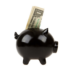 Image showing Black piggy bank with one dollar