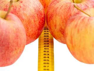 Image showing Red apples with a yellow tape-measure