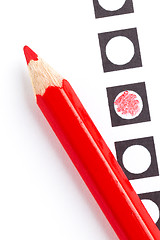 Image showing Red pencil on a voting form