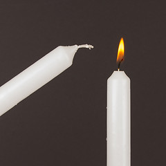 Image showing Burning white candle, isolated