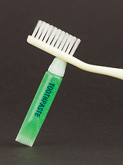 Image showing Toothbrush and green toothpaste isolated