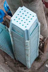 Image showing Stock of blue plastic chairs, isolated