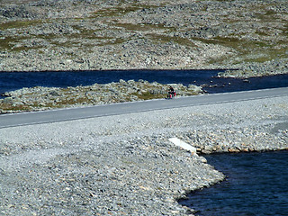 Image showing Cyclist on a scenic road