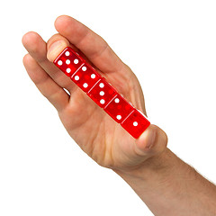 Image showing Man holding five red dice