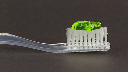 Image showing Toothbrush and green toothpaste isolated