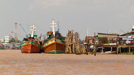 Image showing Fishermen boats in a river in the Mekong Delta