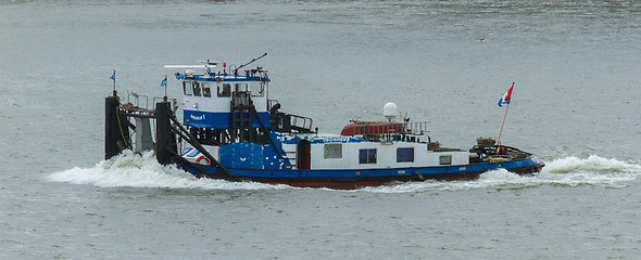 Image showing Pushing boat sailing in the port of Rotterdam (Holland)