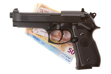 Image showing Semi-automatic gun and money isolated