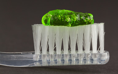 Image showing Toothbrush and green toothpaste isolated