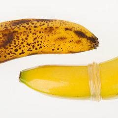 Image showing Healthy banana with condom and ugly banana without condom