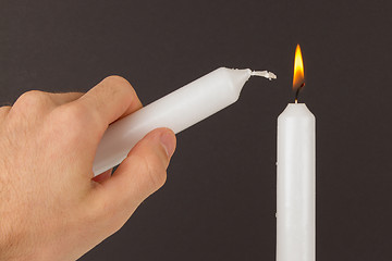 Image showing Burning white candle, isolated