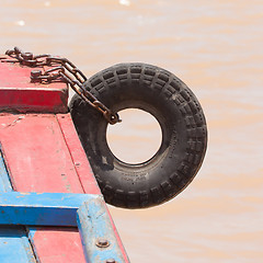 Image showing Fender on a red boat in the Mekong delta