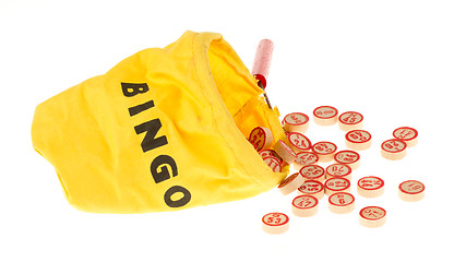 Image showing Wooden kegs in a yellow sack