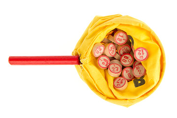 Image showing Wooden kegs in a yellow sack