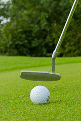 Image showing Golf ball on front of a driver