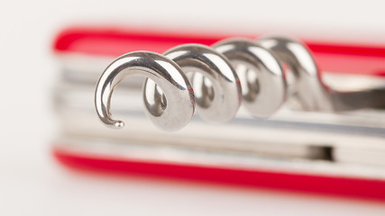 Image showing Red swiss army knife isolated, focus on corkscrew