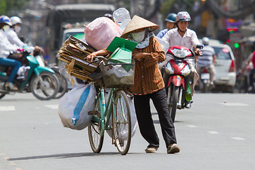 Image showing HUE, VIETNAM - JULY 25. Vietnamese woman packed her possesions o