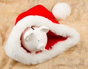 Image showing Piggybank guarding Santa's crisis budget