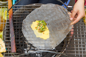 Image showing Rice paper meal being made on a barbeque