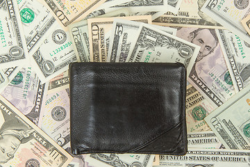 Image showing Old used wallet with dollars 