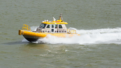 Image showing Yellow Crewtender at high speed