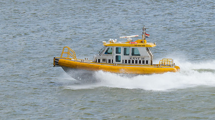 Image showing Yellow Crewtender at high speed