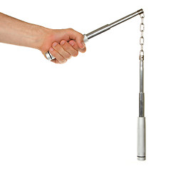 Image showing Hand holding a metal nunchaku