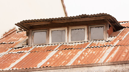 Image showing Old galvanized roof covered in rust